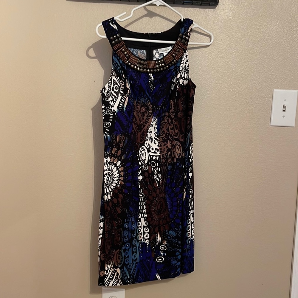 Sleeveless dress, beaded neckline